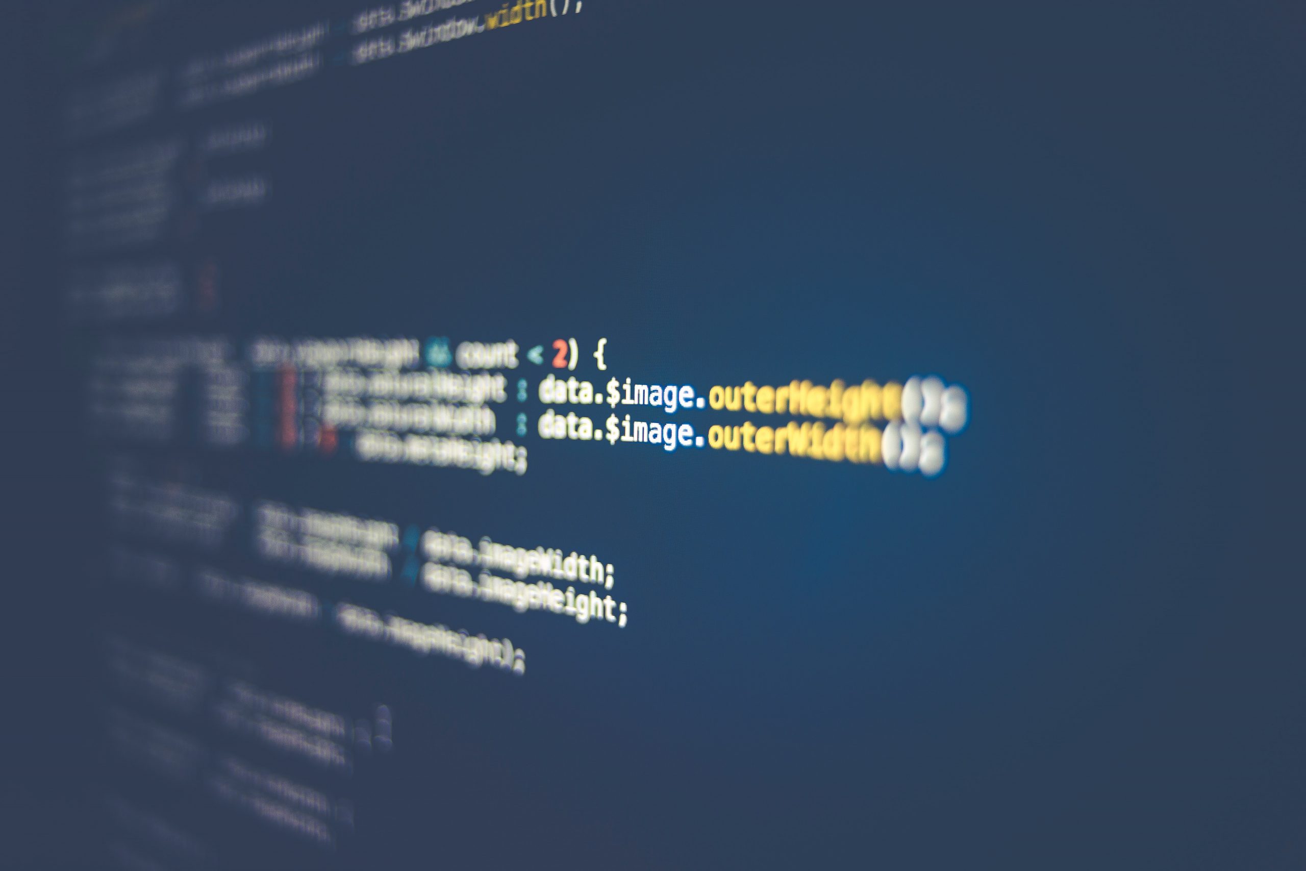 Lines of code on a screen representing network security and vulnerability management